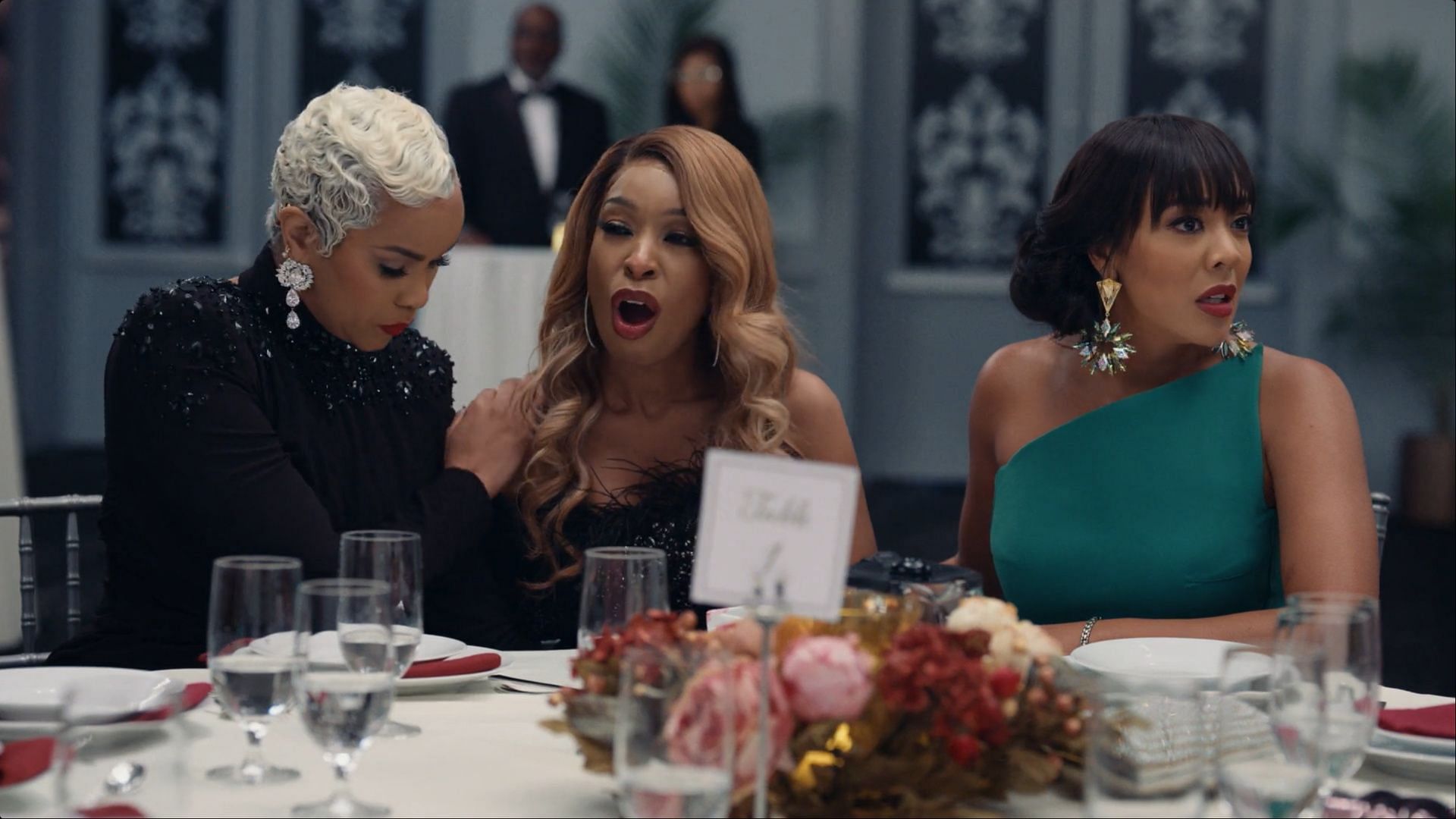 Emotions run high at the banquet table in Tyler Perry’s Divorced Sistas season 1 as Naomi reacts to the unfolding drama (Image via BET+)